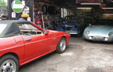Busy classic car garage in Cardiff Wales